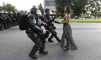 "Taking a Stand in Baton Rouge" Ieshia Evans stands in front of a line of police in Baton Rouge 2016. Jonathan Bachman/Reuters https://en.wikipedia.org/wiki/Taking_a_Stand_in_Baton_Rouge